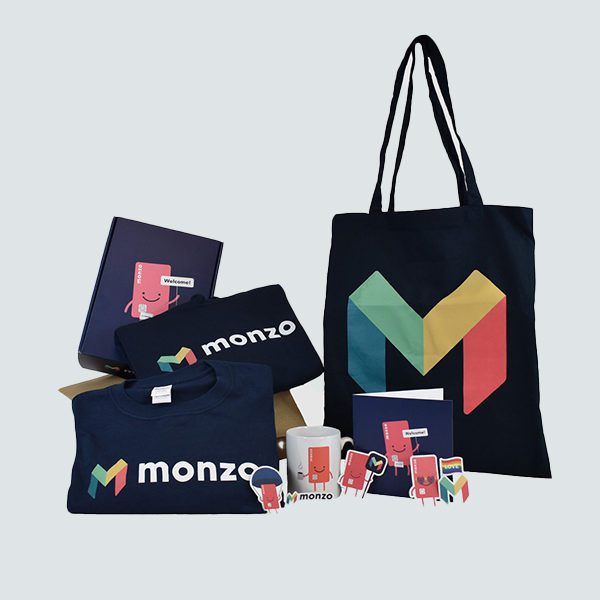 gift ideas for new employees Collection of Monzo branded merchandise t shirt, bag, mug, stickers, printed box