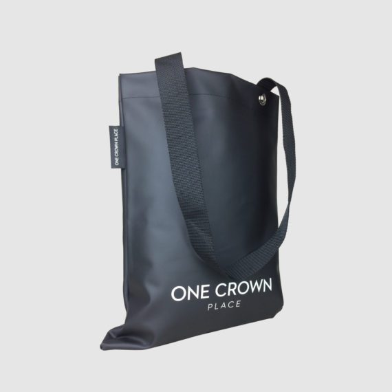 black PU tote bag with black polyester handles and woven label in side hem