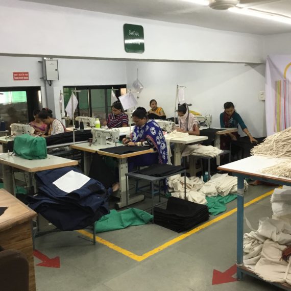 Bag Workshop Factory production team at tables